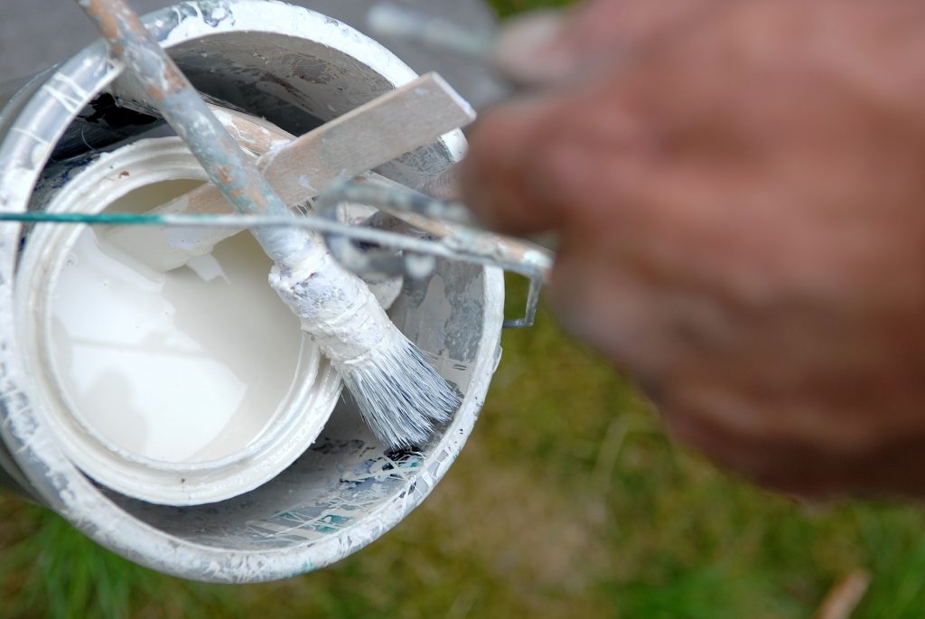 Man holding diy paint bucket